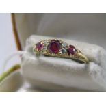 18ct YELLOW GOLD RUBY & DIAMOND OAK STYLE RING, principal oval cut ruby approx 0.5ct set between 2