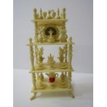 DOLLS HOUSE FURNITURE, a fine Continental ivory whatnot with ornaments, 4" high