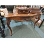 FRENCH BURR WALNUT CENTRE TABLE, foliate and floral carved serpentine topped centre table, on French