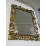 MIRROR, a carved gilt wood foliate and shell surround rectangular wall mirror, 15" x 11"