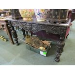 FLEMISH REVIVAL, carved oak serving table, cup and cover pillar supports with mask and foliate