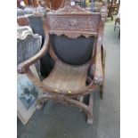 THRONE CHAIR, a carved walnut Italian Renaissance throne chair with demon mask carvings (some