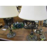 LIGHTING, pair of antique finish metalware candlestick based table lamps and shades