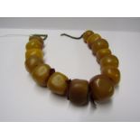 STRING OF UNTESTED HONEY COLOUR BAKELITE AMBER BEADS, approx 155 grams