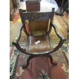 THRONE CHAIR, carved oak X base open armchair with brass studded panel