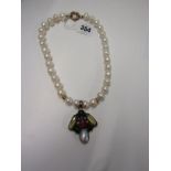 SILVER GILT SET SEMI PRECIOUS STONE PENDANT, On simulated pearl necklace