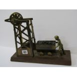COAL MINING, a brass framed model of a coal miner & coal truck by a brass mine shaft on a wooden