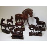 ORIENTAL CARVING, a collection of 7 carved cherry root horses