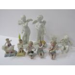 BISQUE PORCELAIN, pair of circular based cherub figures, 5.5" height, together with 7 similar