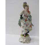 LUDWIGSBURG, gilt scroll base figure of Young Lady with green purse bag, 9" height