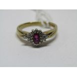 9ct YELLOW GOLD RUBY & DIAMOND CLUSTER, principal oval cut ruby surrounded by brilliant cut