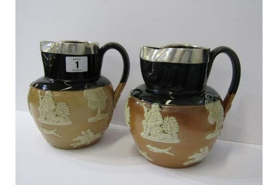 DOULTON STONEWARE, pair of silver lipped stoneware ale jugs with applied hunting and toper