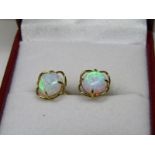 PAIR OF OPAL STUD EARRINGS, cabochon cut opals in 9ct yellow gold floral design mounts