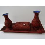 CINNABAR LACQUER DESK SET of cigarette box, rectangular tray and pair of 6" baluster vases with