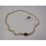 STRING OF PEARLS with 9ct yellow gold stone set pearl clasp, single string of cultured pearls set