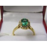 EMERALD RING, 18ct yellow gold ring set an Ethiopian emerald cluster, central emerald approx 1.9