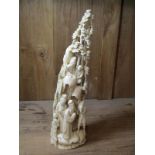 ANTIQUE IVORY CARVING, a signed Chinese carved ivory tusk depicting village life, 11.25" height