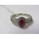 PLATINUM RUBY & DIAMOND RING, by Rhapsody, principal oval cut Burmese ruby of approximately 1ct