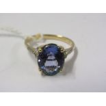 14ct YELLOW GOLD TANZANITE & DIAMOND RING, Principal oval cut tanzanite in excess of 2ct with accent