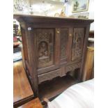 ANTIQUE COURT CUPBOARD, an oak framed cupboard the front doors with carved lion & figure decoration,