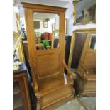 PINE MIRRORED HALL SEAT, ornate foliate carved scroll supports with panelled mirrored back lift