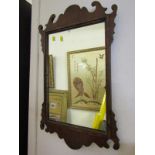 GEORGIAN DESIGN MIRROR, In a carved frame, 26" high.