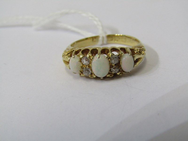 18ct YELLOW GOLD OPAL & DIAMOND RING, 3 principal oval cut opals, each seperated by a pair of old