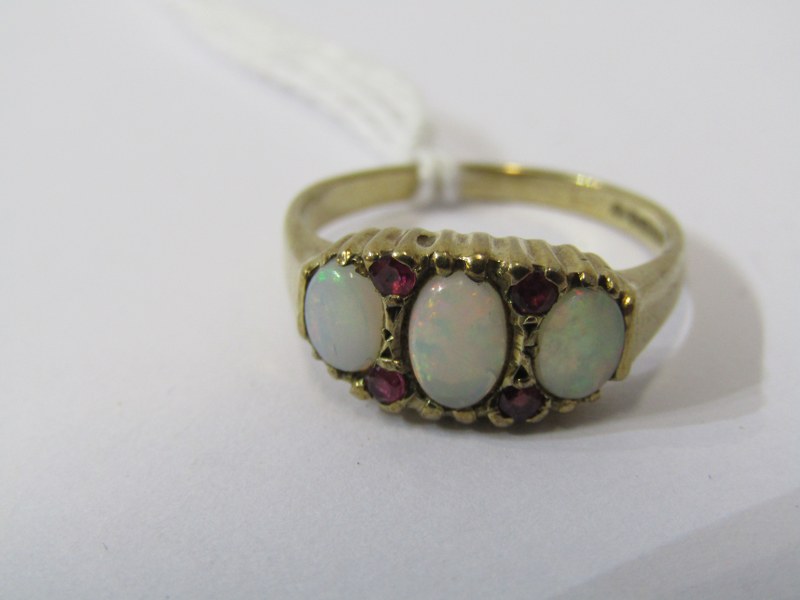 9ct YELLOW GOLD OPAL & RUBY RING, 3 principal oval cut opals each seperated by a pair of small - Image 2 of 4