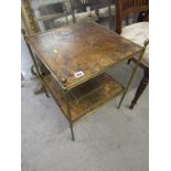 BRASS SIDE TABLE, a brass framed two tier side table with tooled leather tops, 16"