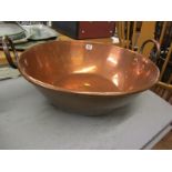 ANTIQUE METALWARE, copper twin handled circular mixing bowl, 19" diameter