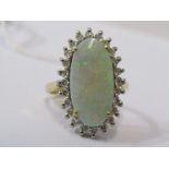 18CT YELLOW GOLD OPAL & DIAMOND CLUSTER RING, principle large oval cabachon opal surrounded by