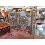 ARTS & CRAFTS, a brass surround triptych design stained glass fire screen