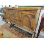 REPRODUCTION CARVED OAK SIDEBOARD, with arch design panel side cupboards flanking 2 foliate carved