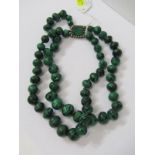 DOUNLE STRING OF MALCHITE BEADSD, on green and white stone clasp