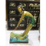 ART DECO, an amusing painted plaster figure of girl surfer, 15.5" Height