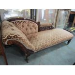 EDWARDIAN CHAISE LONGUE, brown button back upholstered with carved arm support