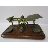 POSTAL SCALES, oak base brass balance scales by S Mordan with 5 graduated weights