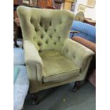 GREEN BUTTON BACK WING ARMCHAIR, on tapering baluster legs