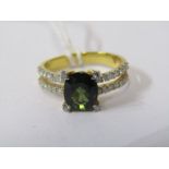 18ct YELLOW GOLD GREEN SAPPHIRE & DIAMOND RING, principal oval cut green sapphire set in diamond tip