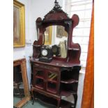 EDWARDIAN MIRROR BACK DISPLAY CABINET, twin cupboard glaze base with shaped open shelves and foliate