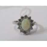 18CT WHITE GOLD OPAL & DIAMOND CLUSTER, principle oval cabochon cut opal surrounded by well