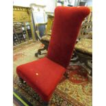VICTORIAN PRAYER CHAIR, red upholstered high back prayer chair with original brass castors