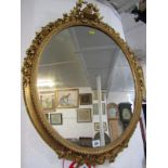 VICTORIAN OVAL MIRROR, crown and wreath crested oval gilt mirror, 29" height 23" width