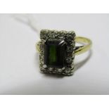 18ct YELLOW GOLD GREEN TOURMALINE & DIAMOND RING, Principal emerald cut green tourmalines surrounded