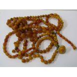 TWO STRINGS OF UNTESTED AMBER BEADS