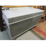 PAINTED DOMED TRUNK, a large 47" width trunk with cast metal carrying handles