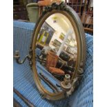 GILT GIRANDOLE, twin branch oval bevel glass girandole mirror, 28" height