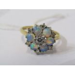 18ct YELLOW GOLD OPAL & DIAMOND CLUSTER RING, principal brilliant cut diamond surrounded by 6 well