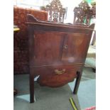 GEORGIAN MAHOGANY COMMODE CABINET, tray top with twin cupboard above sliding drawer base, brass swan
