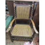 A BARLEY TWIST SUPPORT CARVER, cane panelled seat and back with acorn finials